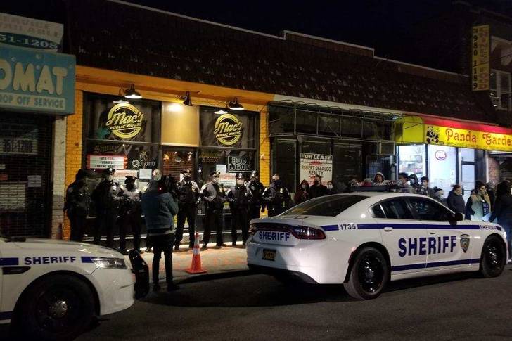 NYC sheriffs lined up outside a Staten Island bar on Tuesday night